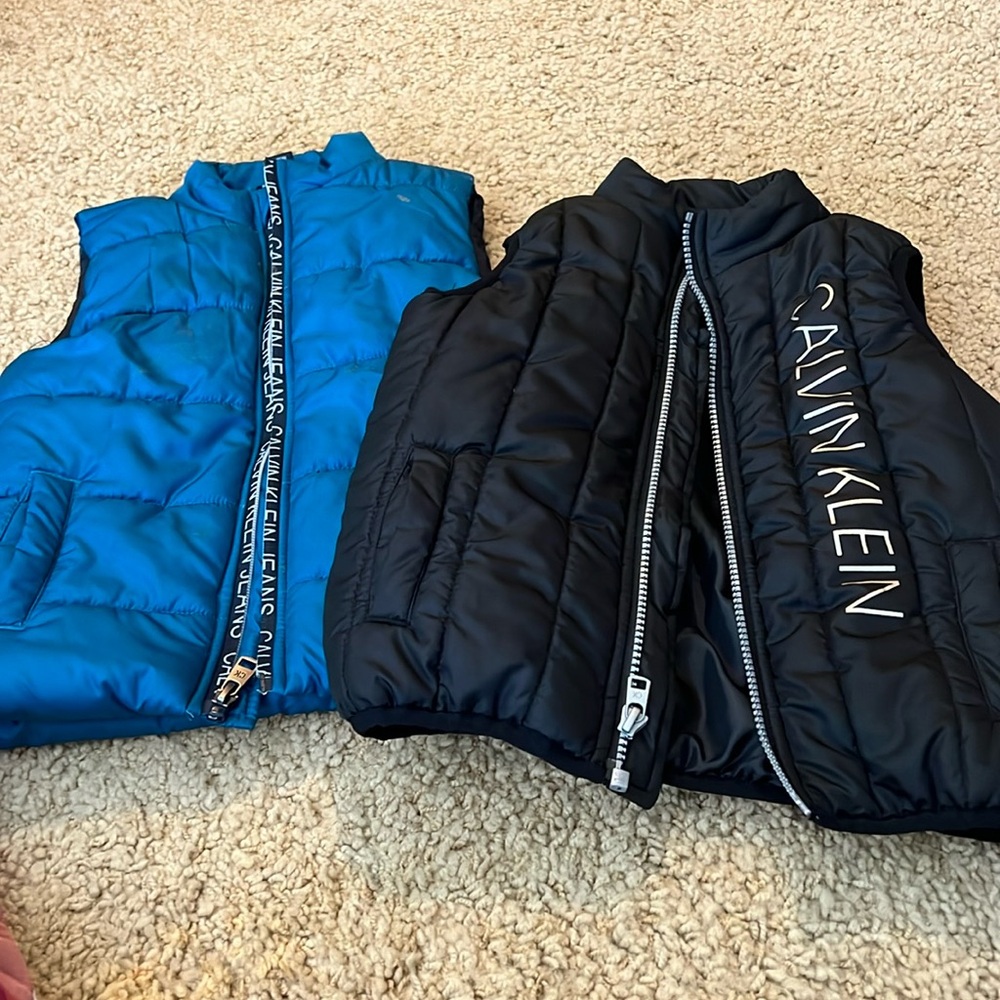 Two adorable Calvin Klein vest for kids
